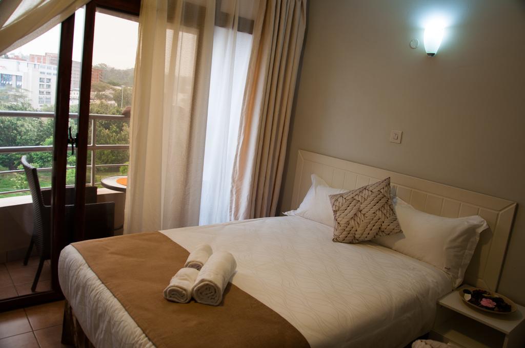 Eddy Suites, Emeli Hotel Найроби Номер фото